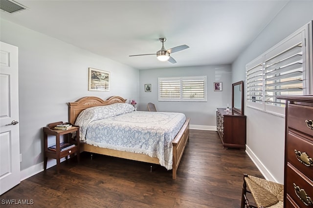 bedroom featuring dark hardwood / wood-style flooring and ceiling fan