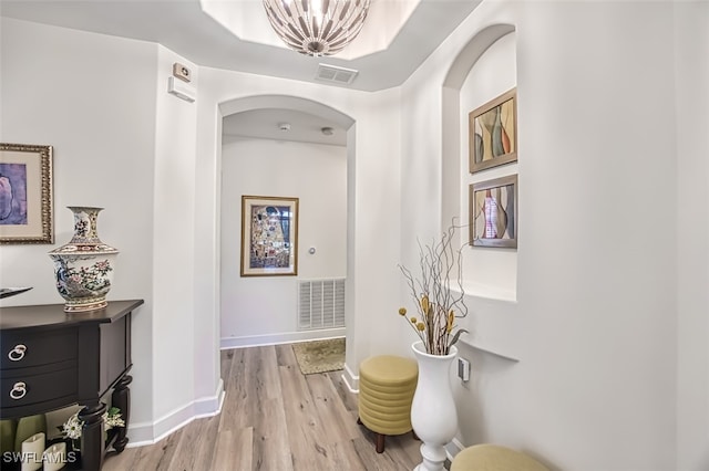 hall with light hardwood / wood-style floors