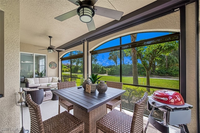 sunroom / solarium with ceiling fan