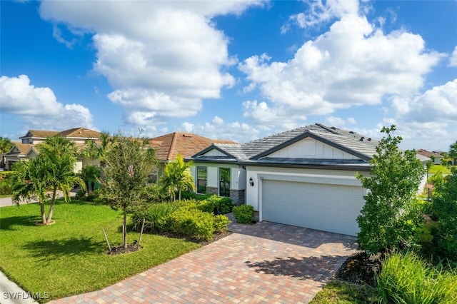 view of front of home featuring a garage and a front lawn