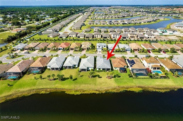 birds eye view of property featuring a water view