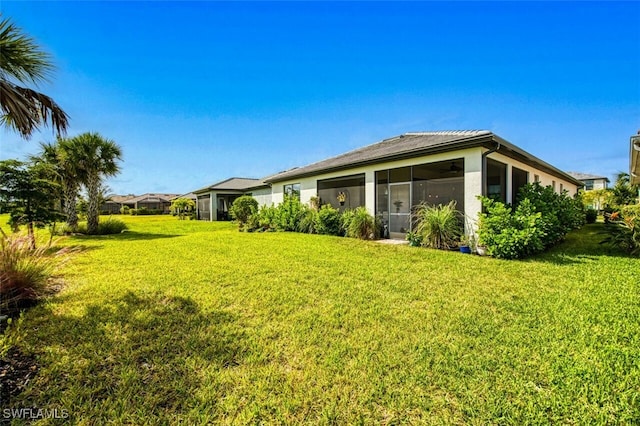 view of yard with a sunroom