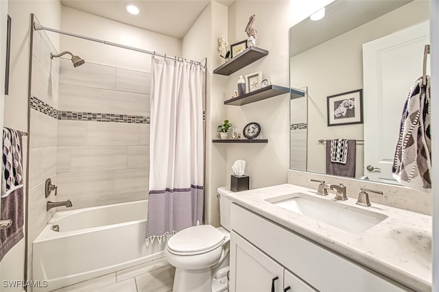 full bathroom with toilet, vanity, and shower / tub combo