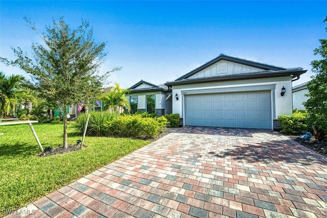 ranch-style house with a front lawn and a garage