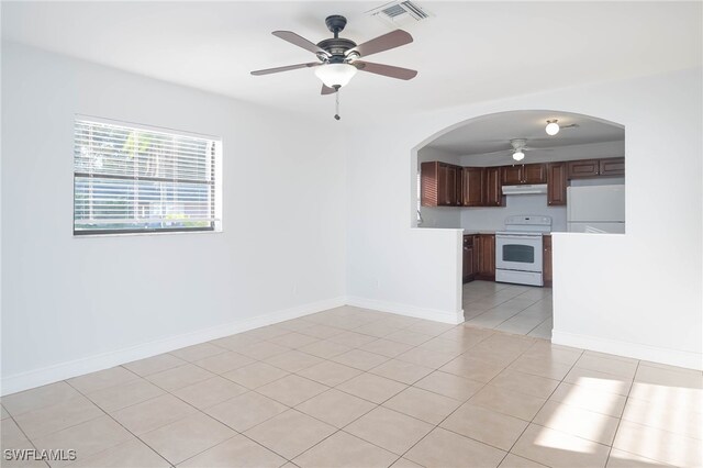 interior space featuring ceiling fan and light tile patterned floors