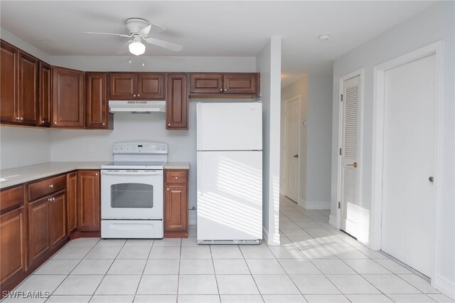 kitchen with white appliances, ceiling fan, and light tile patterned flooring