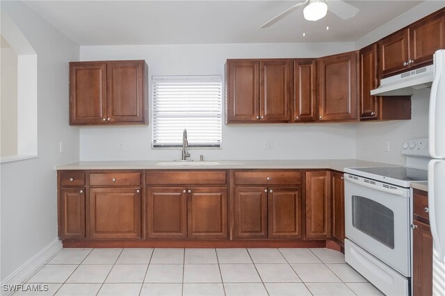 kitchen featuring white electric range, light tile patterned floors, ceiling fan, and sink