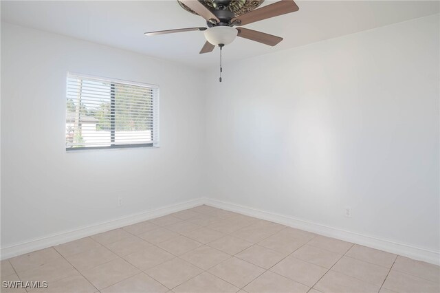 unfurnished room featuring ceiling fan and light tile patterned floors