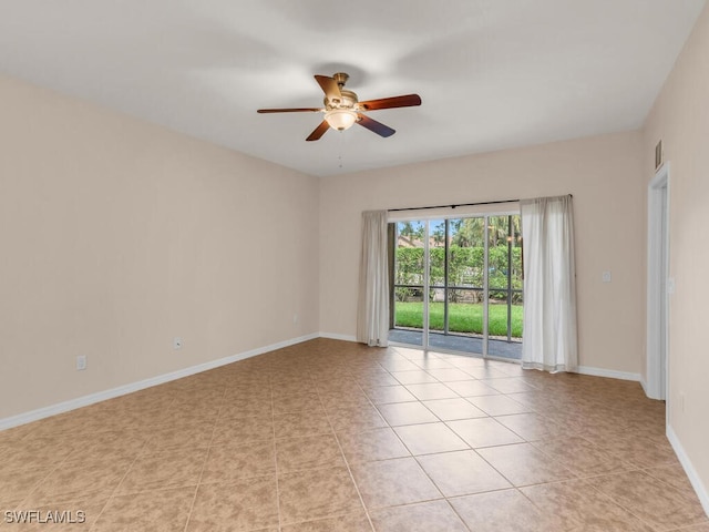 spare room with light tile patterned flooring and ceiling fan