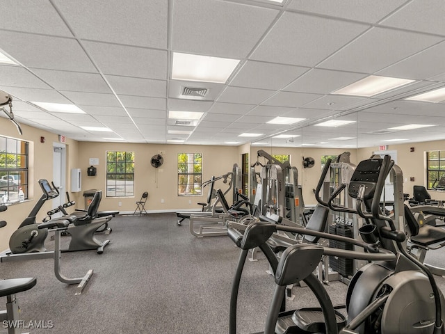 gym featuring a paneled ceiling