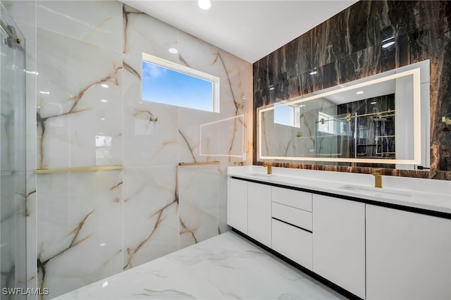 bathroom featuring vanity, tile walls, and a shower with door