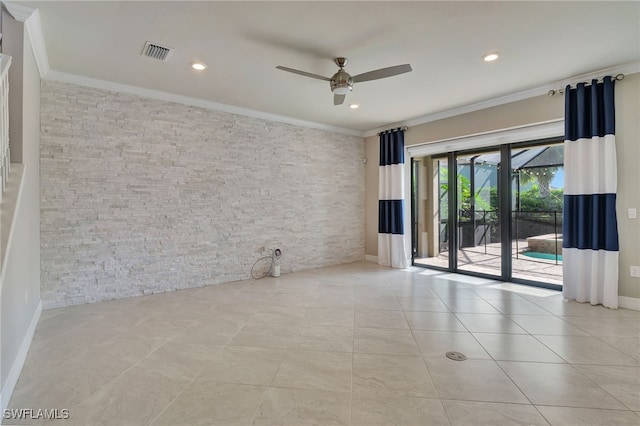 tiled empty room featuring ornamental molding and ceiling fan