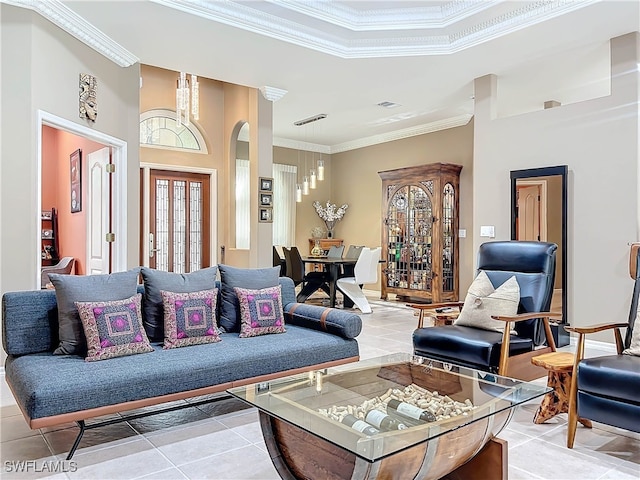 tiled living room featuring crown molding and a towering ceiling