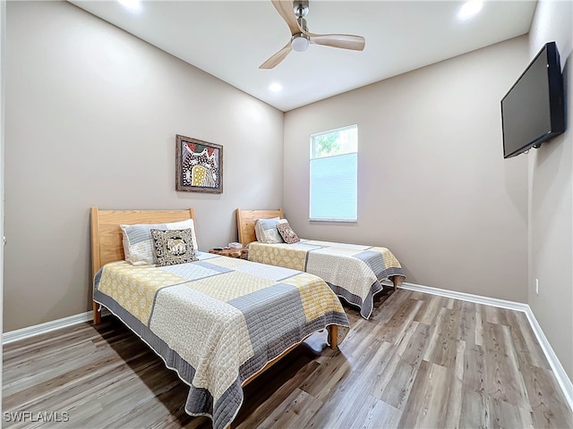 bedroom with recessed lighting, a ceiling fan, baseboards, and light wood finished floors