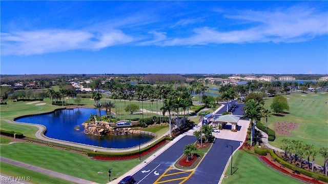 bird's eye view featuring view of golf course and a water view