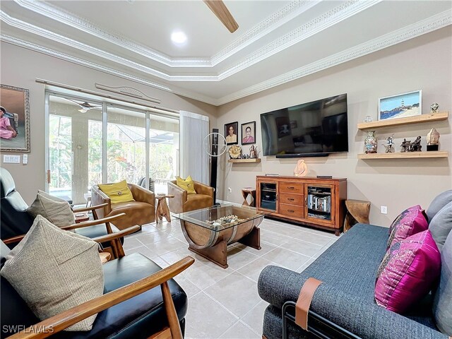 tiled living room featuring a raised ceiling, crown molding, and ceiling fan