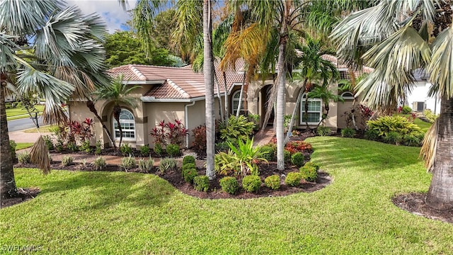 view of front of home with a front lawn