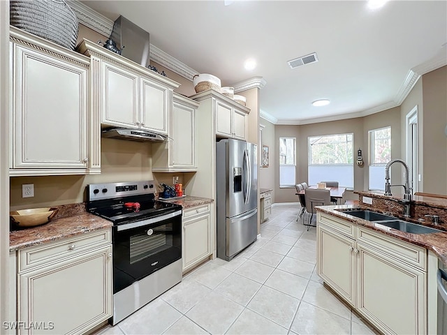 kitchen featuring visible vents, ornamental molding, appliances with stainless steel finishes, and a sink