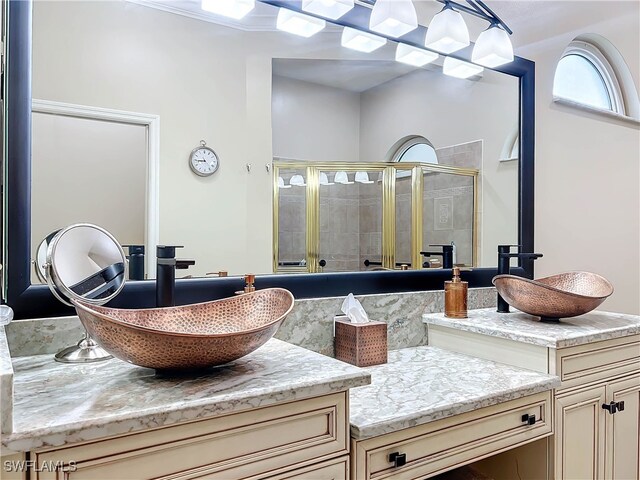 bathroom with vanity and an enclosed shower