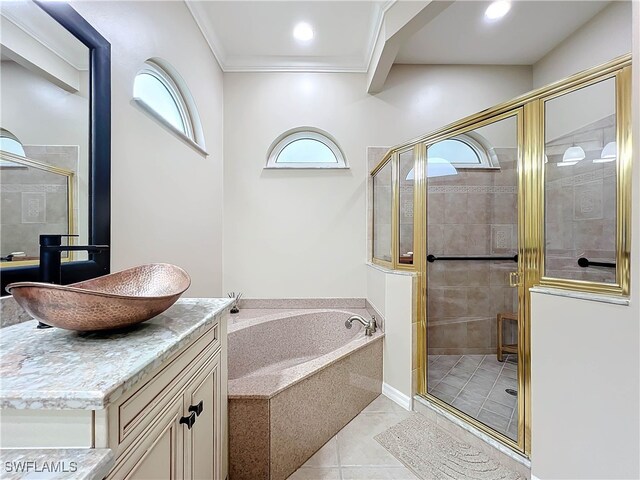 bathroom with tile patterned floors, vanity, crown molding, and independent shower and bath