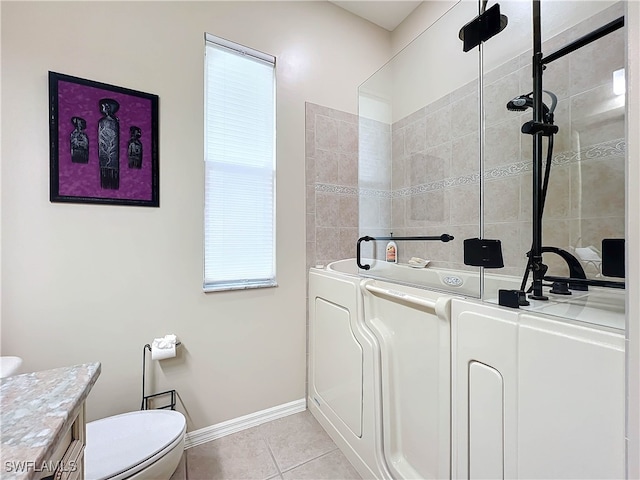 full bath featuring vanity, baseboards, a shower, tile patterned floors, and toilet