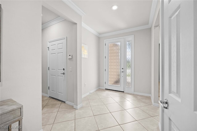 tiled foyer featuring crown molding