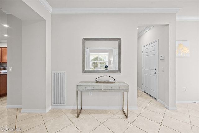 tiled foyer with ornamental molding