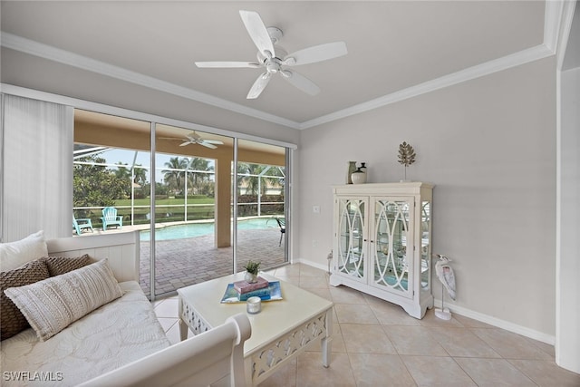 living room with crown molding, light tile patterned flooring, plenty of natural light, and ceiling fan