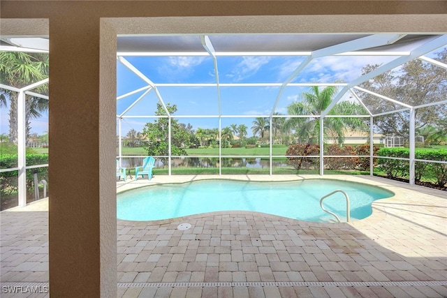 view of pool with a water view, a patio area, and glass enclosure