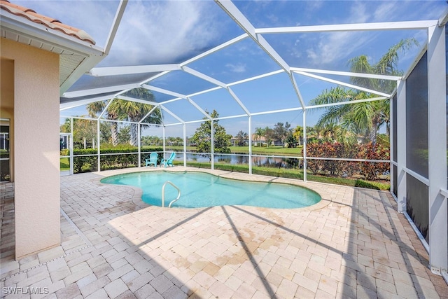 view of swimming pool featuring a patio, a water view, and a lanai