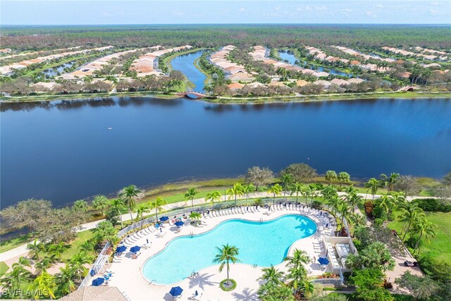 birds eye view of property with a water view