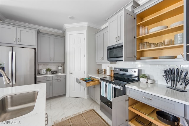 kitchen featuring decorative backsplash, sink, crown molding, appliances with stainless steel finishes, and light stone counters