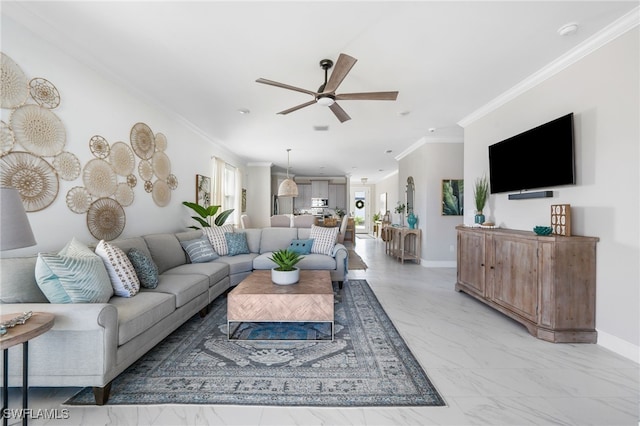 living room with ornamental molding and ceiling fan