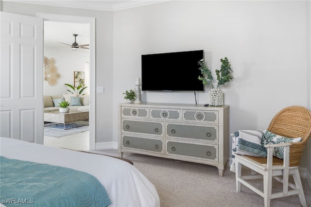 bedroom featuring ornamental molding and light carpet