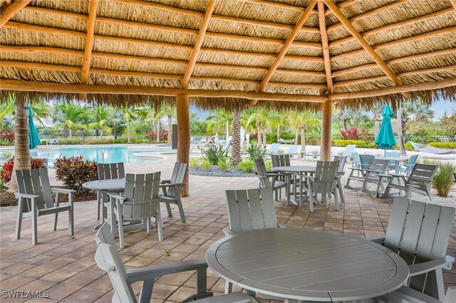 view of patio featuring a gazebo and a community pool