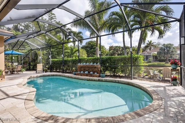 view of pool featuring a lanai and a patio area