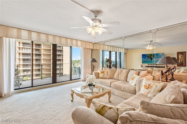 carpeted living room with crown molding and ceiling fan