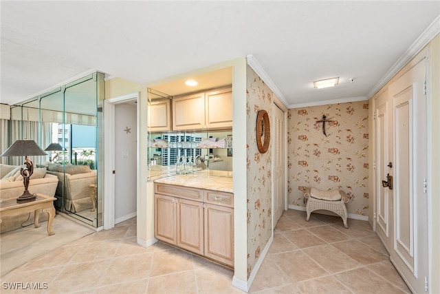 bathroom with ornamental molding and tile patterned flooring