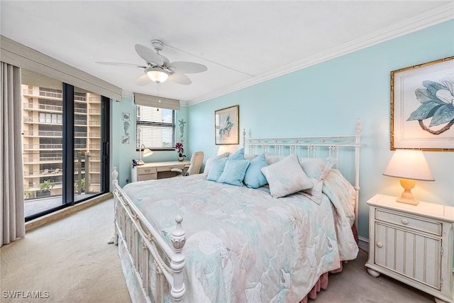 bedroom featuring multiple windows, ornamental molding, light colored carpet, and ceiling fan