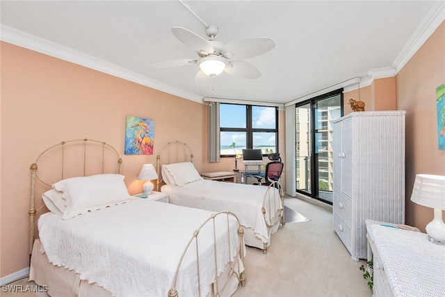 bedroom with ceiling fan, access to outside, ornamental molding, a wall of windows, and light colored carpet