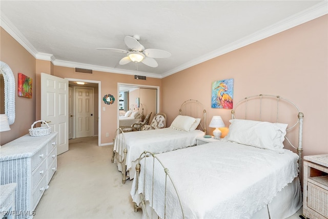 bedroom with light carpet, ornamental molding, and ceiling fan