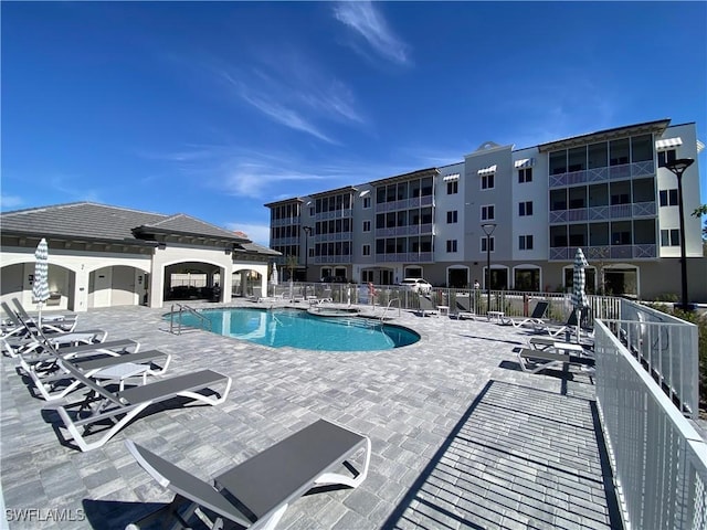 view of swimming pool with a patio area