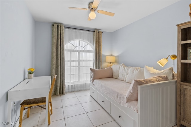 interior space featuring light tile patterned flooring and ceiling fan