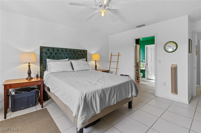 bedroom with ceiling fan and light tile patterned floors