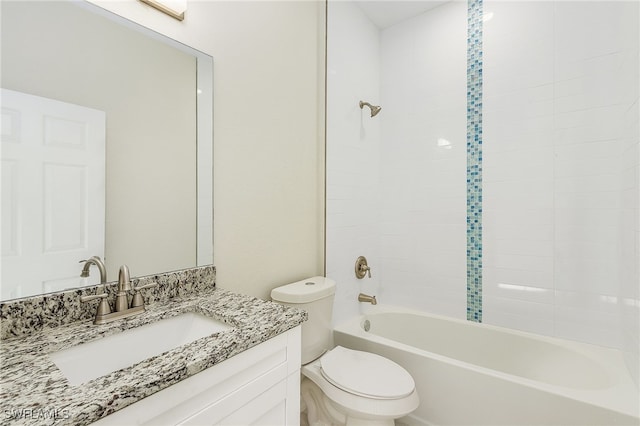 full bathroom with vanity, toilet, and tiled shower / bath combo