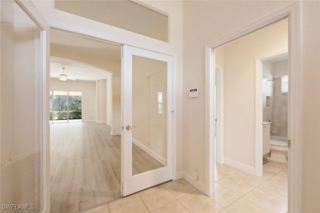 hallway with light tile patterned flooring