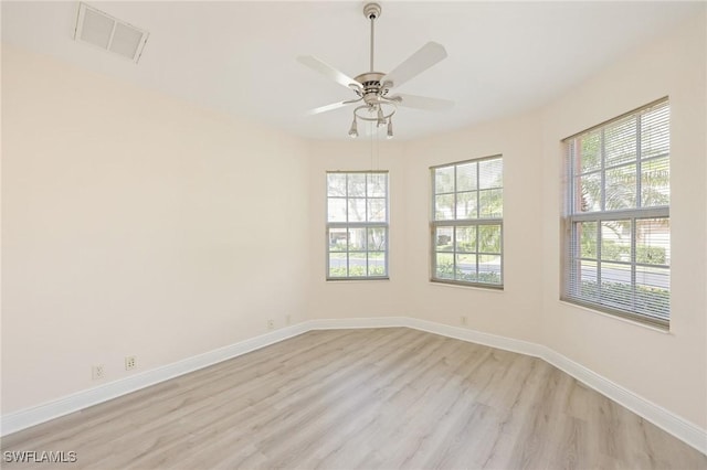 empty room featuring ceiling fan and light wood-type flooring