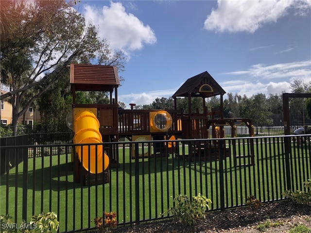 view of playground featuring a lawn