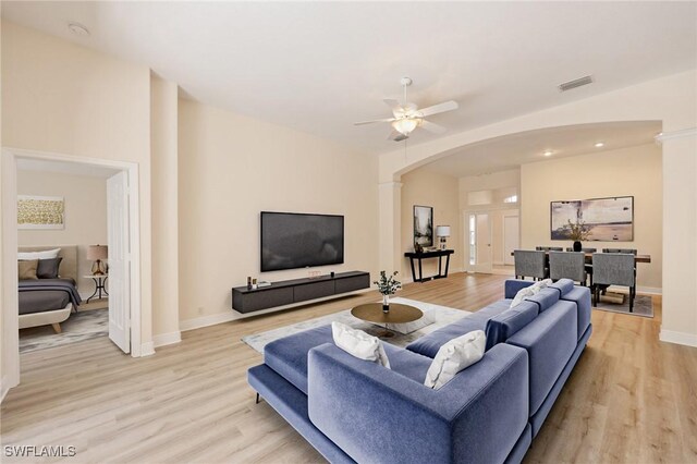 living room with ceiling fan and light hardwood / wood-style floors