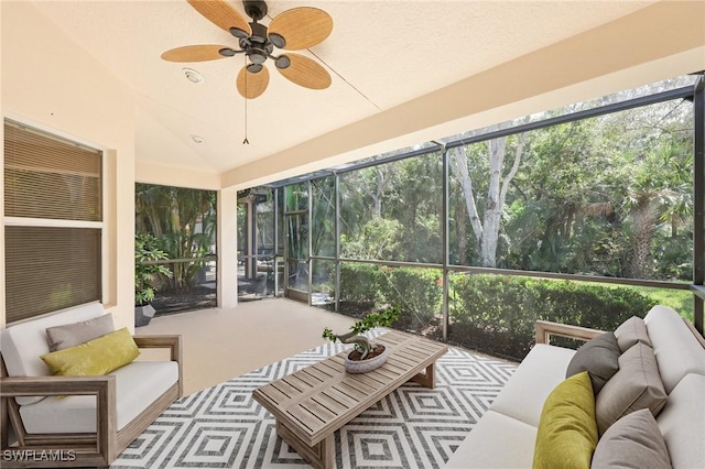 sunroom with ceiling fan and lofted ceiling